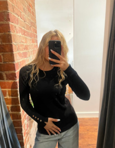 Storewide Discount Collection: Arlo Crew Neck Button Cuff Knit Top in Black