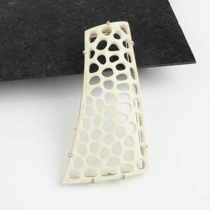 Asymmetric antler brooch