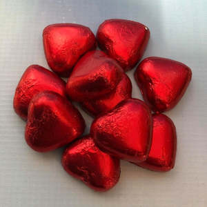 Christmas Sprinkles Candy: Foil covered chocolate hearts Red