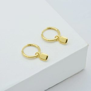 Linda Tahija: Tate Huggie Hoop Earrings - Gold