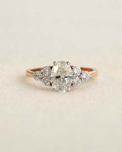 Frontpage: 1.42 Ct Oval Cut Lab Diamond Cluster Engagement Ring in Rose Gold