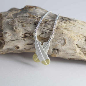 New: Little Taonga | Crossed Huia Feather Necklace