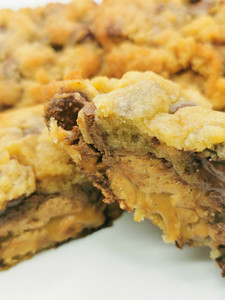 Products: NYC Style Snickers Stuffed chocolate chip Cookies Hello Delicious