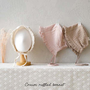 Cream ruffled bonnet