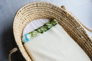 Products: Baby blanket - green patterned silk binding, 100% NZ Merino wool