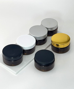 Products: PET Boston Round 50ml Nicki Jar - Amber fitted with various lids. - Lotus Oils New Zealand