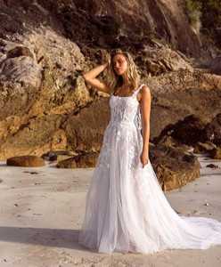 Products: Discover the stunning wedding dress Jayce ML22777 from Madi Lane now on SALE with her square bodice and slim a line skirt - Madison Rose Bridal
