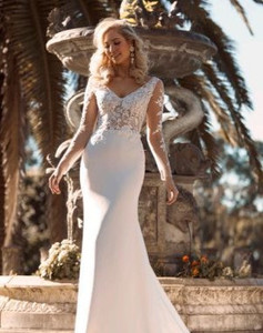 Products: Brae - ML18033 - Madi Lane Fall in love with the modern elegance and simplicity Brae offers. Fitted silhouette with lace illusion bodice and sleeves. In Madison Rose Bridal - Sale Gown US6