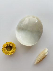 Products: Selenite Large Palm Stone - Marigold and Amber