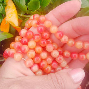 Dyed Jade: 8mm rounds - strand of 48 beads: Rosy Apricot