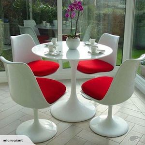 Dining Chairs: White Fiberglass Tulip Armless chair