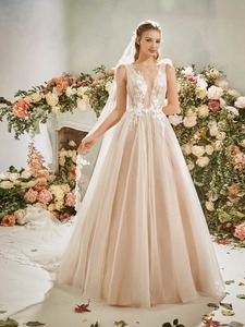 Products: Soft tulle wedding gown with floral appliqued plunging bodice