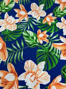 Products: IP76 – Island Prints – Deep Peach Orchid Flowers on Royal Blue – 1.15cm wide – 65% Polyester / 35% Cotton – pm – Special $5.00 per mtr – Moreland Fabrics