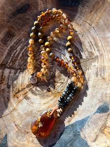Mālā with Rare Blue Amber, Citrine, Tigerseye and Onyx Beads with a Blue Amber Pendant
