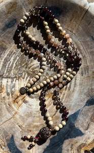 Mālā with Garnet, Smoky Quartz, Sunstone and Lotus Seed Beads with a Carved Lo&hellip;