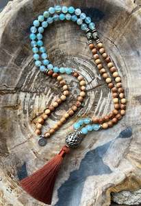 Malas: Mālā with Lake Blue Agate and Pearwood Beads with a Nepalese Silver Guru Bead, and a silky Tassel
