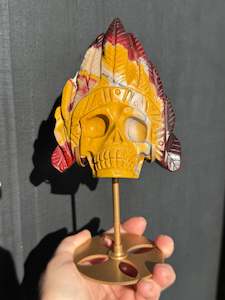 Mookaite Jasper carved Skull with Feathers on a stand
