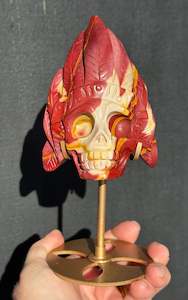 Mookaite Jasper carved Skull with Feathers on a stand