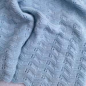 Blankets: "Waves" hand knit merino cot blanket