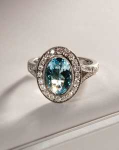 Oval Cut Aquamarine With Bead-set Halo