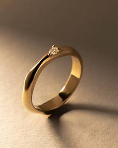 Curved Wedding Band with a Pear Shaped Diamond