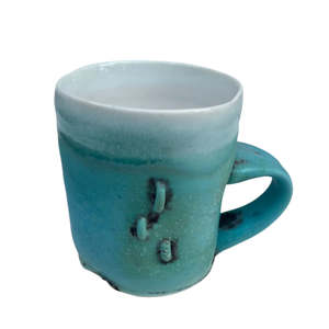 Drinkware: Turquoise Cup with X and 3 Staples