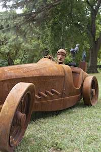 Sculpture On The Peninsula Finale Event: Caricature: Ron Roycroft and the Bugatti / Jaguar