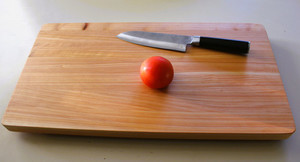 Products: Canterbury Macrocarpa Chopping Board with legs on bottom Woodnbits