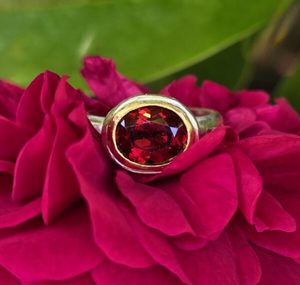 Products: Contessa Ring. 10x8mm African garnet, silver and 24ct gold. Size P - Penelope Barnhill Jewellery