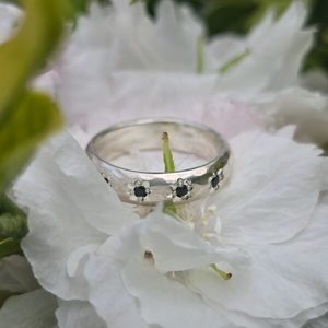 Products: Dahlia ring. half round sterling silver, flower set black spinels. - Penelope Barnhill Jewellery