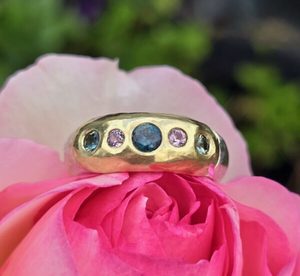 Eclipse ring. 18ct green gold and silver set with pink and green sapphires. Size&hellip;