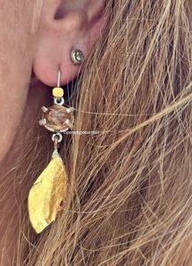 Products: Florette earrings. 10x9mm imperial topaz from Ouro Preto with hematite and goethite inclusions, silver, 24ct gold - Penelope Barnhill Jewellery