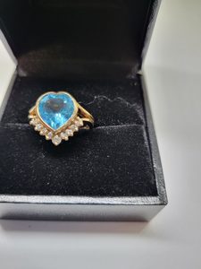 Products: 9ct Blue Topaz and Diamond Dress Ring