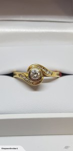 Products: 18k Solitaire Diamond Ring With Diamonds Either Side With Val of $3,300.00