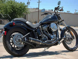 Softail 2 1: Bob Cat 2-into-1 Exhaust - Black with Black Satin Sleeve Muffler. Fits Softail 1986-2017 & Rocker 2008-2011. - D&D Exhaust