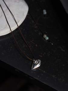 Silver Almond Shell on Brown Silk Necklace