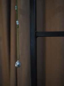 Silver Moon Shell on Green Silk Necklace