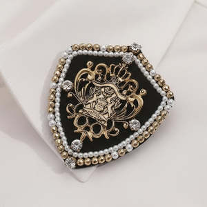 Vintage Crest Black & Gold Brooch