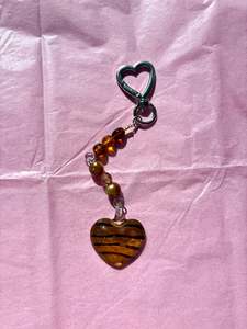 Accessories: Heart-shaped beaded keychain | Brown