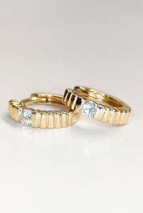 Earrings: Yellow gold ribbed diamond hoops