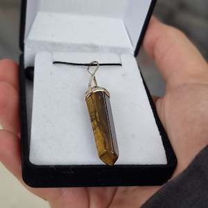 Crystal Point Pendants: Tigers eye silver point pendant