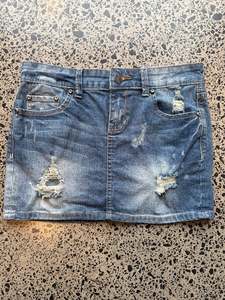 Mini Skirts: Ketzeke Mid Blue Denim Skirt with Rips - S