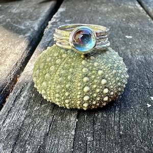 Spinner And Unity Rings: Sky Blue topaz fine unity ring