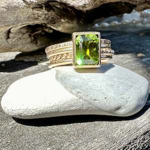 Spinner And Unity Rings: Peridot fine unity ring