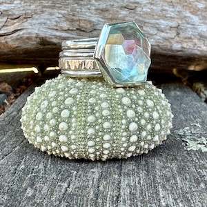 Spinner And Unity Rings: Faceted aquamarine Unity ring