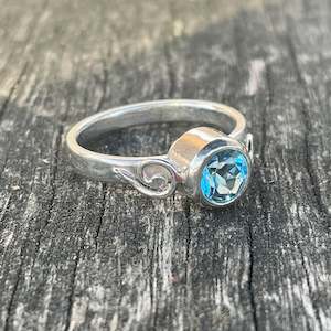 Sky blue topaz koru ring