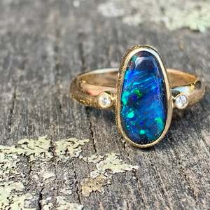 Opal: 9ct Gold Lightning Ridge Black Opal Ring with Diamonds