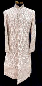 Indo Western: (Video clip attached )Cream Gold Beige color pink color heavy embroidery work all over with hand work pearl beaded neck, buttons and sleeves design Sherwani and Pants