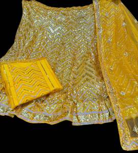 Party Wear Lehnga: Mustard color Netting based full of sequined work multiflared beautiful lehnga with embroidery work design in blouse and embroidery dupatta (Unstitched Lehnga)