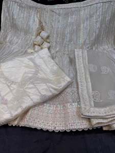 Party Wear Lehnga: (Video clip attached )Party wear cream color multicoloured sequined and embroidery work multiflared very heavy lehnga with heavy work design in blouse and embroidery dupatta (Unstitched Lehnga)